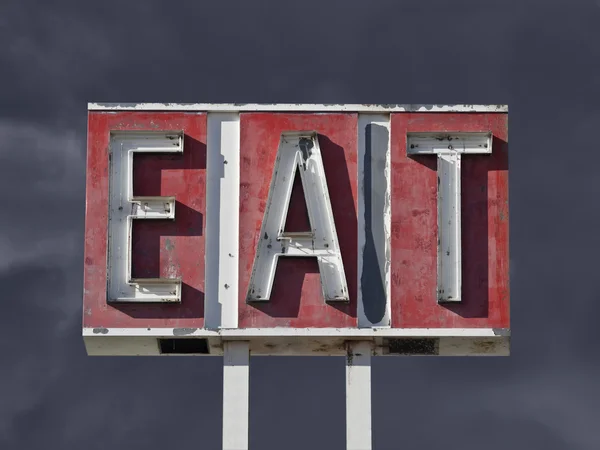 Vintage Eat Sign with Dark Thunderstorm Sky — Stock Photo, Image