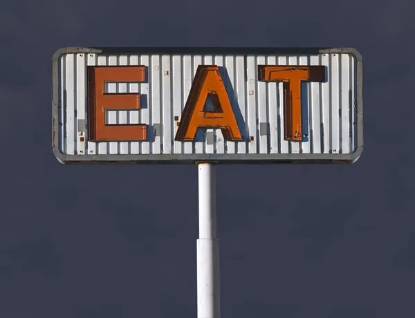 Old Eat Sign with Storm Sky — Stock Photo, Image