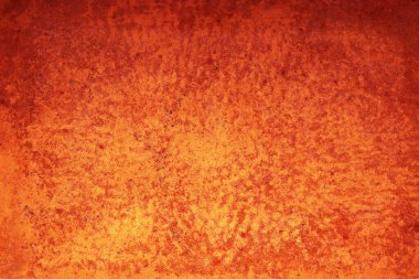 Paslı yüzeyi olan turuncu metal bir levhanın arka plan fotoğrafı.