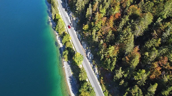 Aerial Drone Shot Red Car Road Lake Autumn Forest —  Fotos de Stock