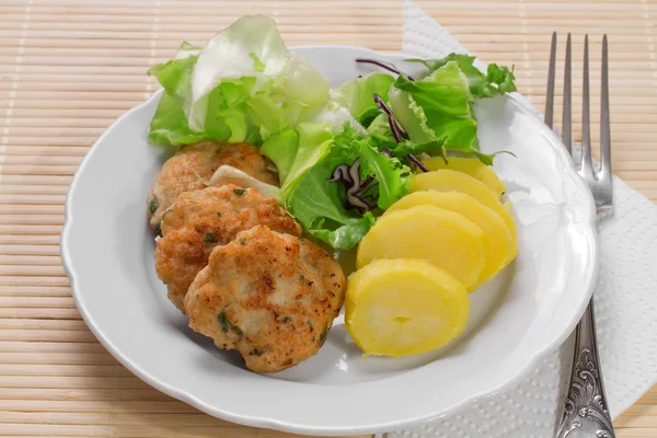 Hamburgers with mint and potatoes — Stock Photo, Image