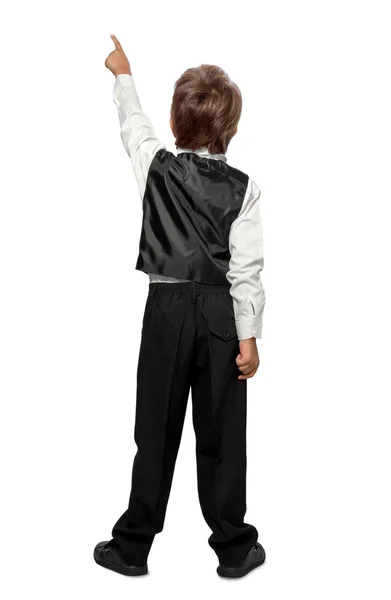 Child in a tuxedo pointing at wall. Rear view. Isolated over wh — Stock Photo, Image