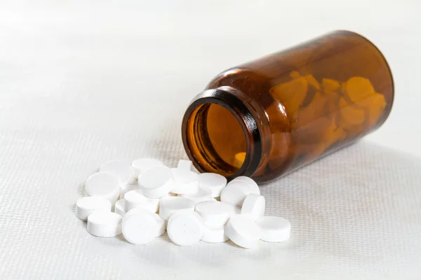 Pills in medical bottle on the table. — Stock Photo, Image