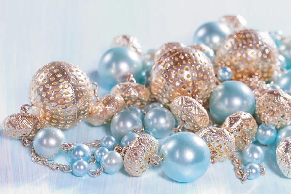 Blue beads on a wooden background closeup — Stock Photo, Image