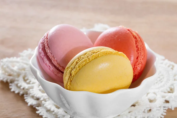 French macarons on a wooden background. — Stock Photo, Image