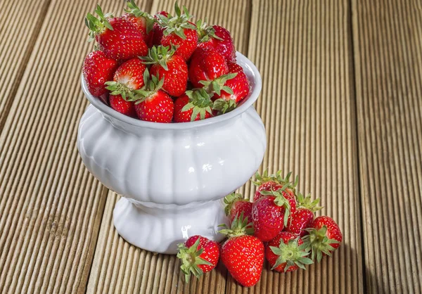 Ripe strawberry on a wooden background — Stock Photo, Image