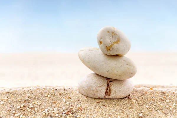 Stack of zen stones on sand beach — Stock Photo, Image