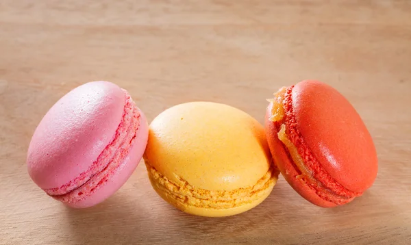 French macarons on a wooden background. — Stock Photo, Image