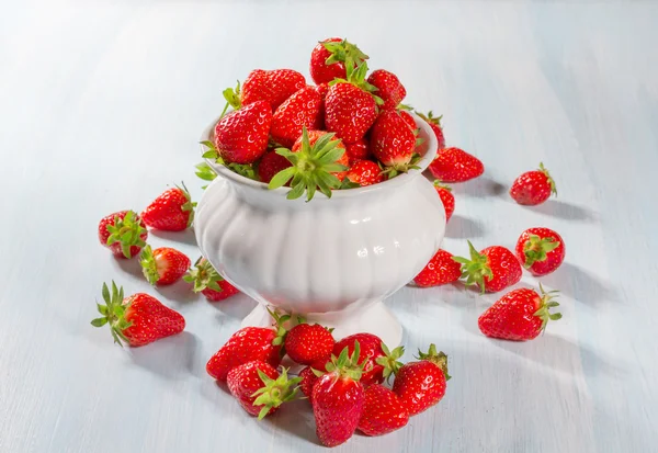 Ripe strawberry on a wooden background — Stock Photo, Image