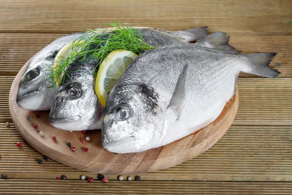 Fresh Dorado on a wooden background — Stock Photo, Image