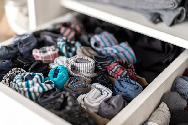 Home drawer box with organized folded underwear lingerie KonMari marie kondo vertical storage method. Sorted many different undergarments pants and socks at bedroom dresser — Stock Photo, Image