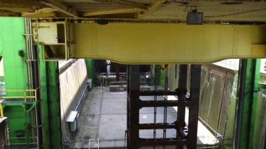 Inside detail view of big metal Rothensee Magdeburg river ship lift mechanism going down after elevating boat on water canal. industrial engineering heavy shiplift equipment.