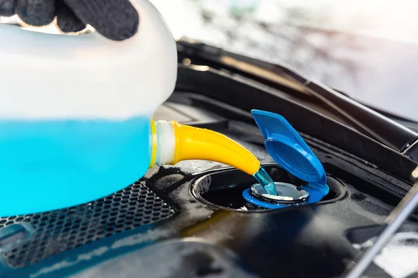 Close Detail Driver Mechanic Hand Gloves Pouring Blue Antifreeze Liquid — Stockfoto