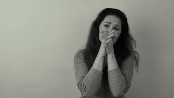 Portrait of a beautiful sad woman in a depressed state gesturing with her hands. — Video Stock