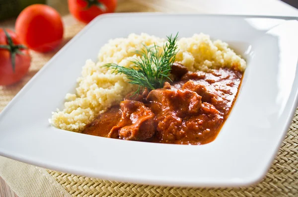 Tomato curry with couscous — Stock Photo, Image