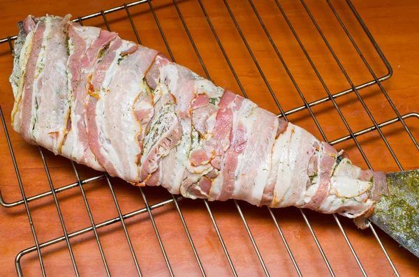 Fish wrapped in bacon — Stock Photo, Image