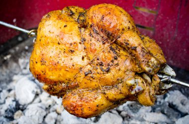 Whole chicken on the grill clipart