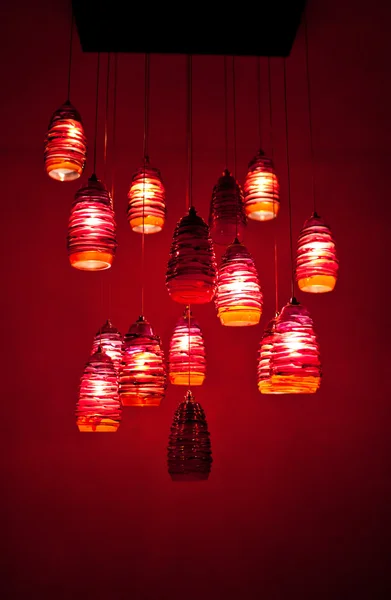 Red chandelier hanging on the ceiling — Stock Photo, Image