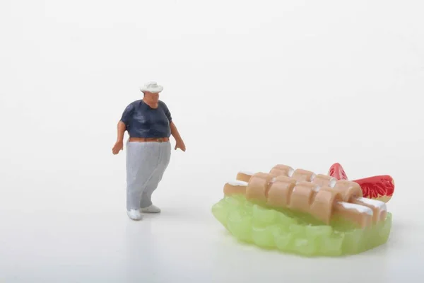 Miniature Figurine Fat Man Giant Meat Skewers — Stock Photo, Image