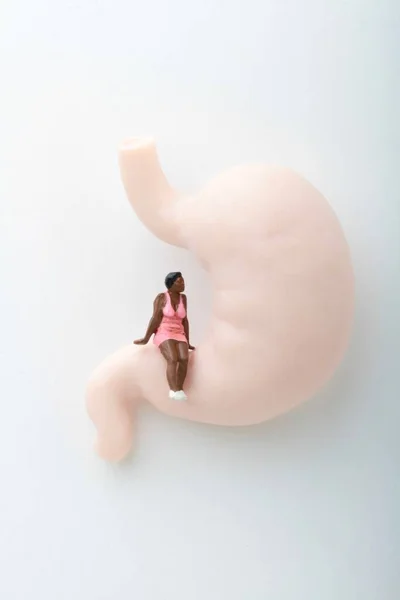 Miniature Figurine Black Girl Sitting Giant Stomach — Stock Photo, Image