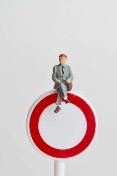 Miniature Figurine Business Man Sitting Denied Access Sign — Zdjęcie stockowe