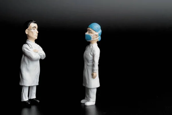 Miniature Figurines Nurse Doctor Black Background — Stok fotoğraf