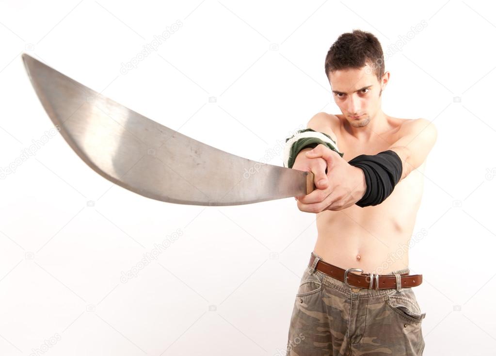 Young fighter holding a machete Stock Photo by ©filomedia 12416528