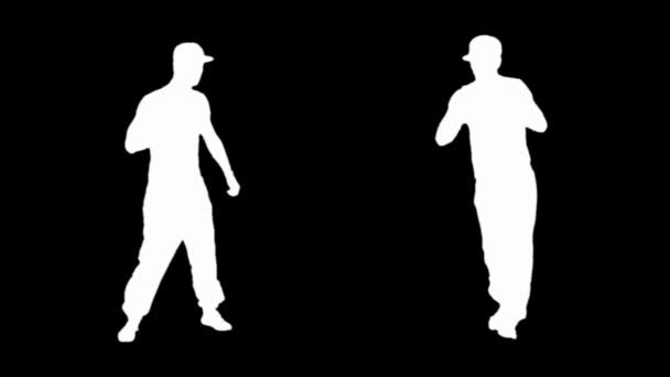Silhouet van een jonge man breakdancing — Stockvideo