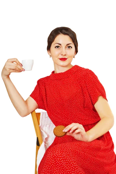 Mujer sosteniendo una taza de café y galletas —  Fotos de Stock