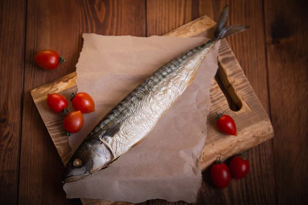 Hot smoked mackerel on the table in the kitchen. Studio photo.