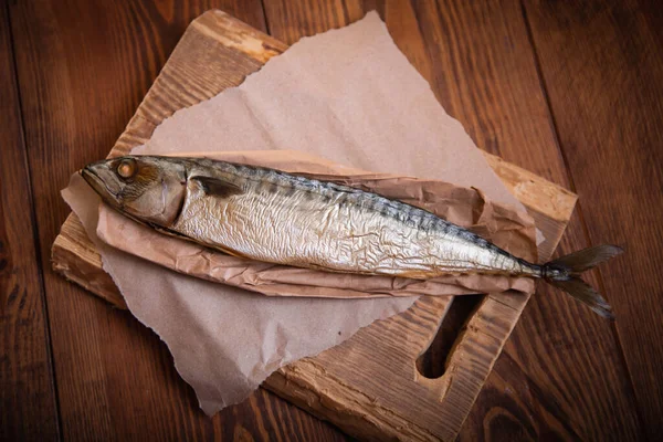 Hot smoked mackerel on the table in the kitchen. Studio photo.