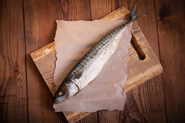 Hot smoked mackerel on the table in the kitchen. Studio photo.