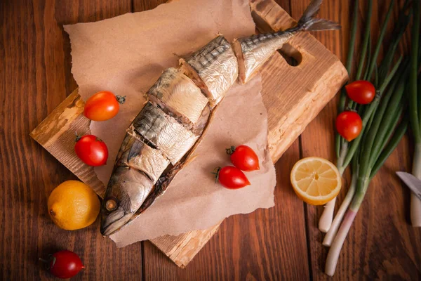 Hot smoked mackerel on the table in the kitchen. Studio photo.