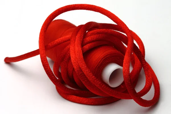 Red threads and red band Stock Image