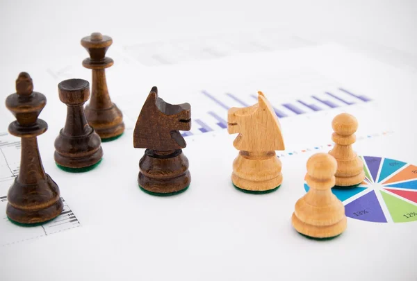 Chess pieces on business background. Company strategic behavior — Stock Photo, Image