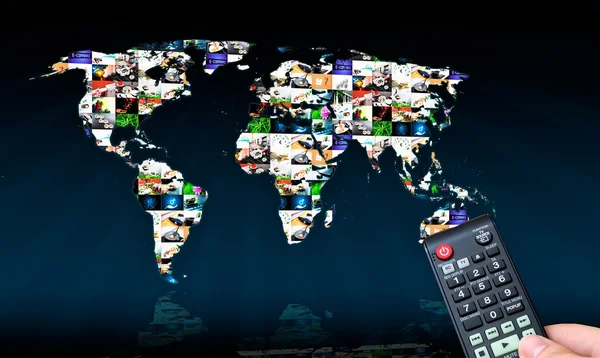 Remote control with virtual multimedia screen in background. World map composition — Stok fotoğraf