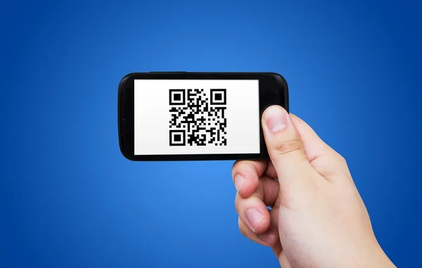 Smartphone scanning QR code — Stock Photo, Image