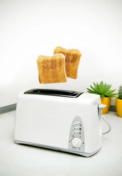 Jumping toasts. Prepare breakfast in kitchen — Stock Photo, Image