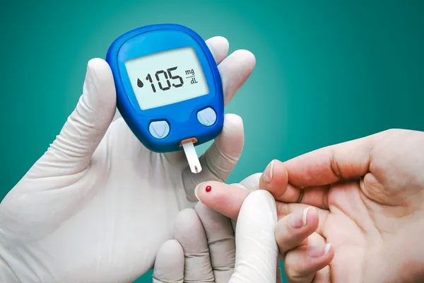 Doctor making blood sugar test. Stock Photo