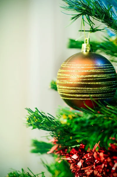 Closeup of christmas tree with bauble — Stock Photo, Image