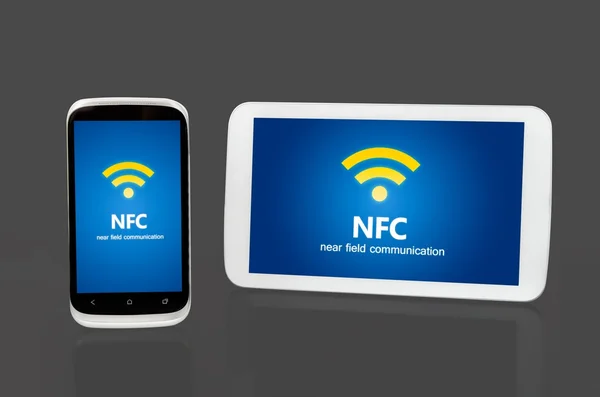 Mobile devices with NFC chip. Wireless communication and payment — Stock Photo, Image