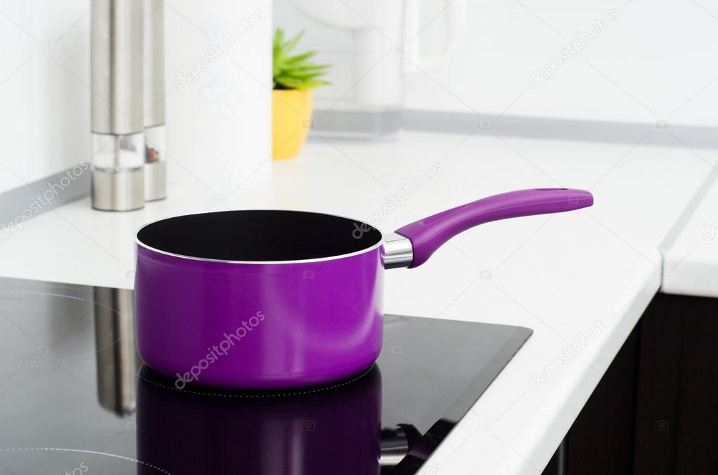 Pan in modern kitchen with induction stove