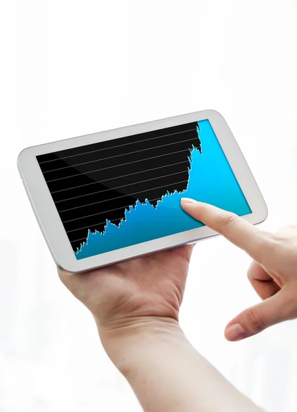 Woman pointing tablet with growing chart on screen — Stock Photo, Image