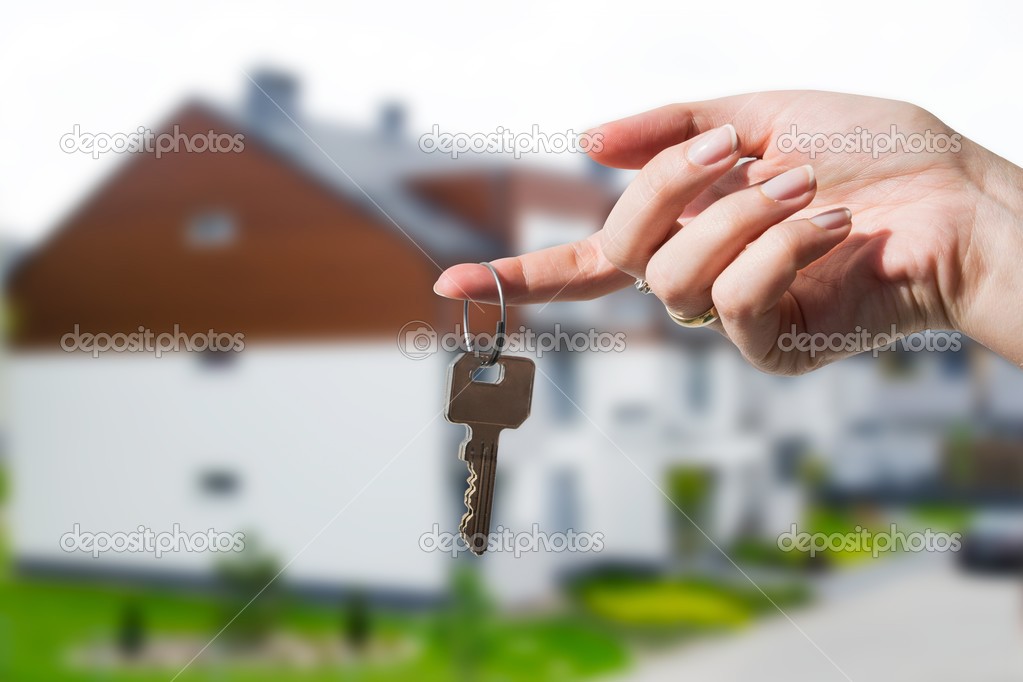 Woman's hand holding keys to new house