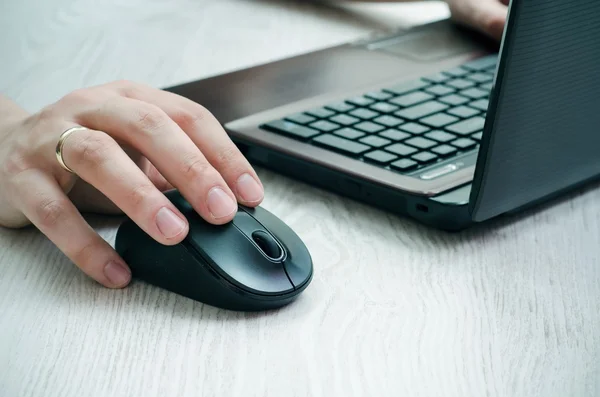 Man working with laptop on wooden background — Stock Photo, Image