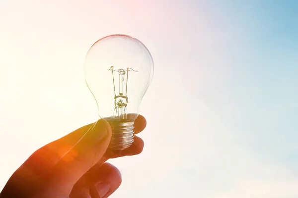 Global Energy Crisis Concept Man Holding Bulb — Stock Photo, Image