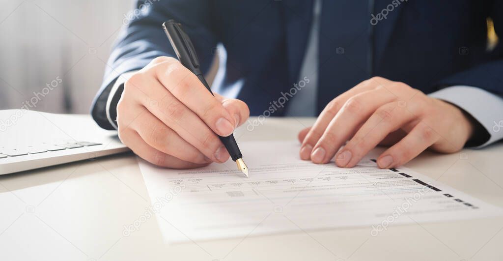 Attorney, clerk, bookkeeper working in the office. Signing contract or agreement concept