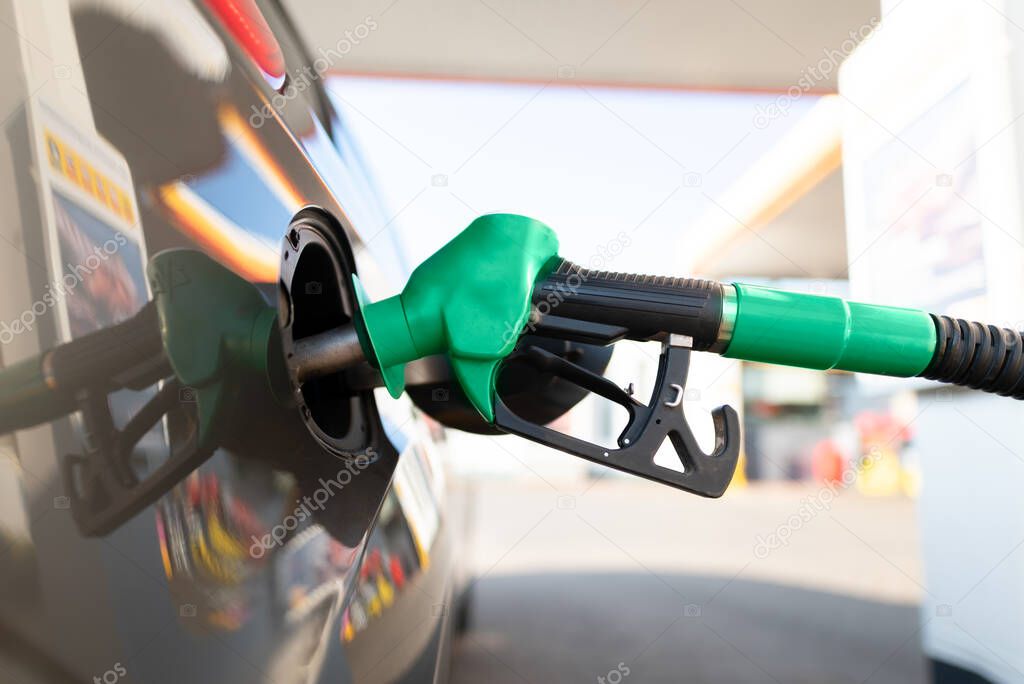 Vehicle fueling facility at petrol station. Fuel gasoline dispenser