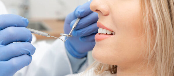 Woman patient in dentist office. Perfect smile concept