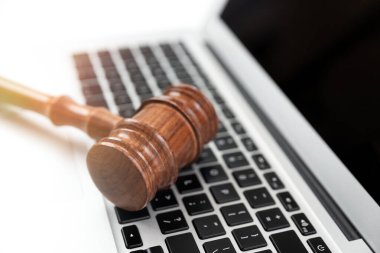 Cybercrime concept with gavel on laptop. Law and justice.